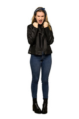 A full-length shot of a Teenager girl with leather jacket frustrated by a bad situation on isolated white background