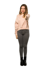 A full-length shot of a Teenager girl with pink sweater shaking hands for closing a good deal over isolated white background