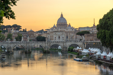 Sunset Panorama of Tiber River, St. Angelo Bridge and St. Peter's Basilica in Rome, Italy
