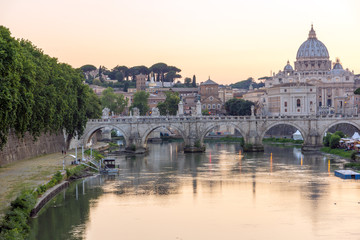 Naklejka na ściany i meble Sunset Panorama of Tiber River, St. Angelo Bridge and St. Peter's Basilica in Rome, Italy