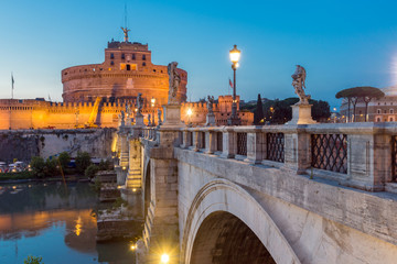 Sunset view of St. Angelo Bridge and castle st. Angelo in city of Rome, Italy