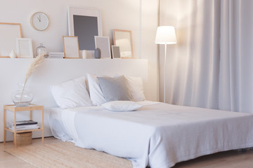 modern bedroom with floor lamp and decorations