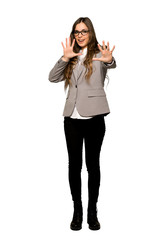 Fototapeta premium Full-length shot of Business woman is a little bit nervous and scared stretching hands to the front on isolated white background