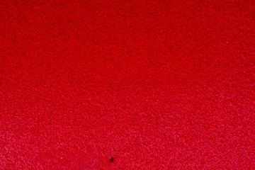 A close up view of the red pattern material. 