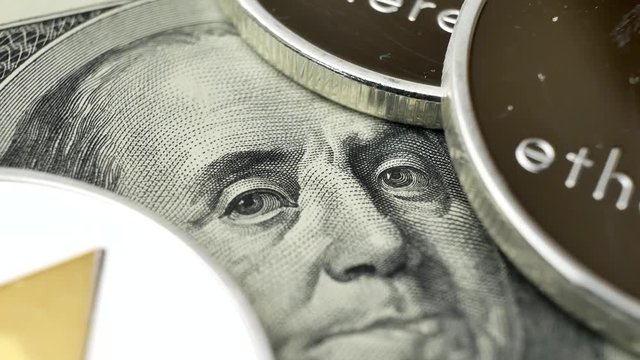 Ethereum ETH coins rotating on bills of 100 dollars