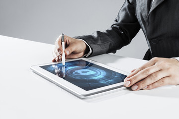 Internet security concept with woman working on media screen with stylus