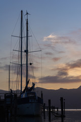 Contour of a yacht during moody sunset