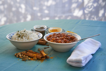 Typical indian dish served like lunch in garden of indian restaurant made from spicy hot chickpea...