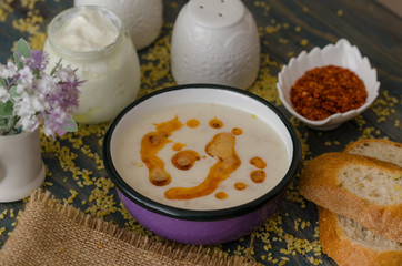 Tasty traditional soup on wooden table
