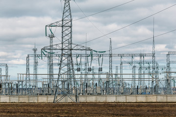 High-voltage electricity transmission pylon power lines and towers. Industrial electricity distribution