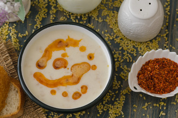 Tasty traditional soup on wooden table