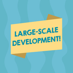 Conceptual hand writing showing Large Scale Development. Business photo showcasing Develop on an extensive basis grow up a lot Blank Color Folded Banner Strip Style Announcement Poster