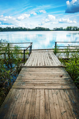 vintage wooden pier on beautiful blue  lake