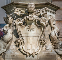 Pope Clement XI coat of arms in the Pantheon Fountain. Rome, Italy.