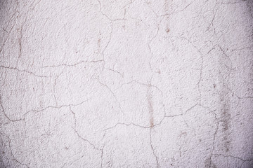 Texture of cement wall surface with cracked decorative plaster