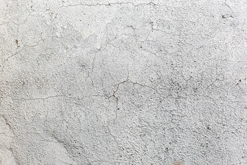 Aged street wall background, texture with cracks and scratches