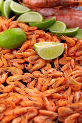 Shrimps.Cooked shrimps. .A lot of little shrimps with lime .Copy space