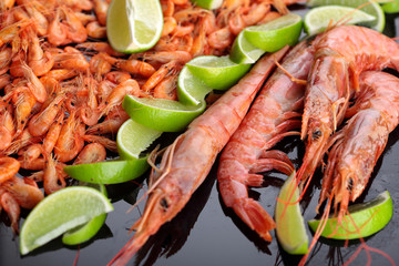 Shrimps.Raw fresh shrimps with lime .Big Shrimps.A lot of little shrimps.