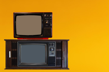 Vintage Television or old retro TV on yellow background
