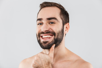 Obraz premium Close up of a young handsome bearded shirtless man