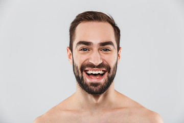 Obraz premium Close up of a young handsome bearded shirtless man