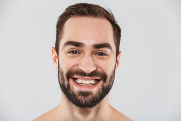 Obraz premium Close up of a young handsome bearded shirtless man