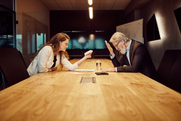 handsome caucasian senior CEO at a meeting.