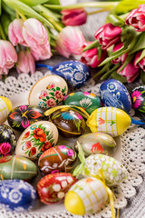 Multicolored spring tulips and Easter eggs with decorations