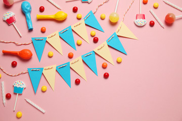 Festive decor for children's birthday. Sweet multicolored candies, balloon, straws.