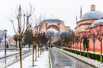 Snowy day in Sultanahmet Square. View of HAGIA SOPHIA. Istanbul, Turkey.