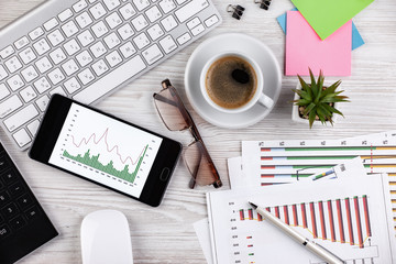 Items for business on a light background on the table, view from the top