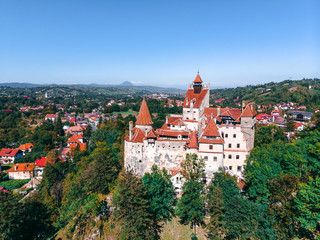 Fototapeta na wymiar Beautiful Aerial panorama scenic view of medieval Dracula castle in Bran, Transylvania Romania, summer, autumn day. Tourism, travel, vacation concept