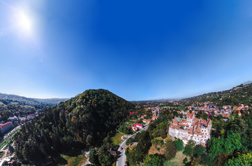 Beautiful Aerial panorama scenic view of medieval Dracula castle in Bran, Transylvania Romania, summer, autumn day. Tourism, travel, vacation concept, copy space