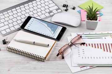 Items for business on a light background on the table, view from the top