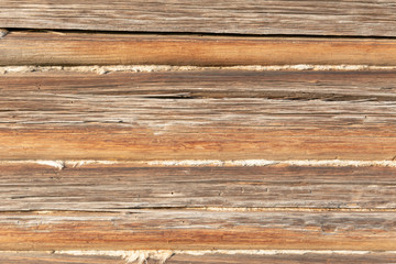 Obraz premium The wooden wall of the log house