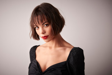 Fototapeta premium Attractive young woman studio portrait