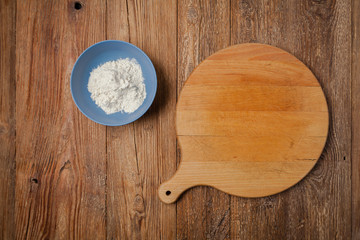 Empty pizza delivery board with flour. Top view. Concept.