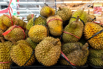 Fresh exotic tropical fruit durian on sale on a local market, Bali island.