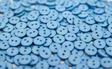 plastic plastic buttons pellets scattered on a white background