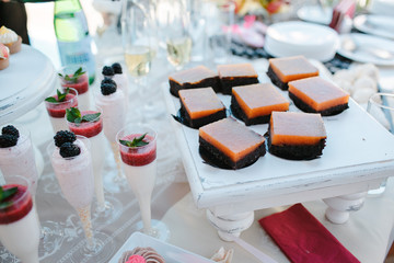 Candy bar decorated with different sweets, open background.