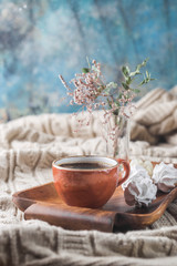 Hot Coffee cup on tray over background of the plaid