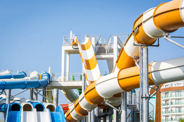 Dangerous water slides with pipes in water park.