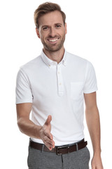 smiling casual man welcomes with a handshake