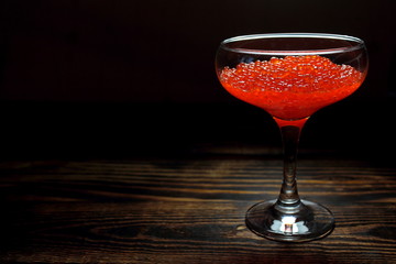 Red salmon caviar in a glass goblet
