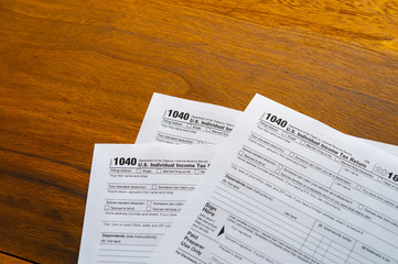 1040 Tax Return Form on the Dark Red Background