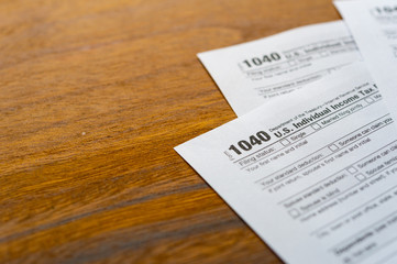 1040 Tax Return Form on the Dark Red Background