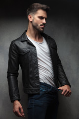 sexy man in leather jacket showing how thin he is