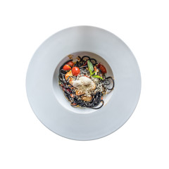 Top view of black pasta with seafood and parmesan cheese. Isolated on white background.