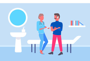 female doctor giving injection vaccine shot to male patient vaccination concept modern hospital room interior full length flat horizontal