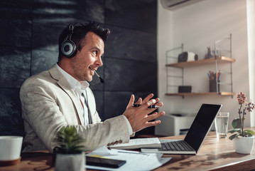 Businessman having online meeting in his office